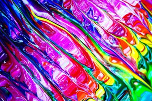 Bold and colorful abstract paint strokes showcasing a vibrant rainbow palette.